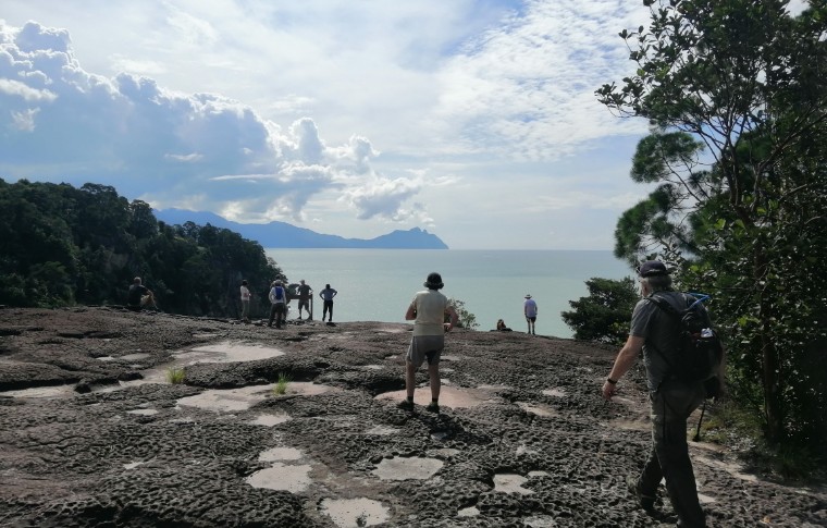 Guests explore rock formations in Bako National Park.