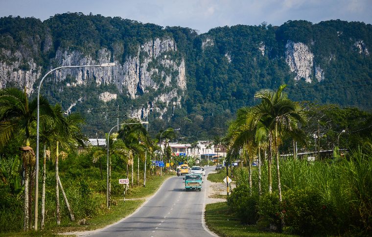 Batu Niah against the backdrop of Niah Caves Comples.