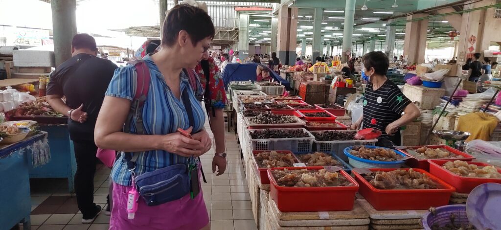 Visitors checking out a jelly fish vendor at Sibu Central Market, a 1200-vendor strong wet and dry market in Sibu.