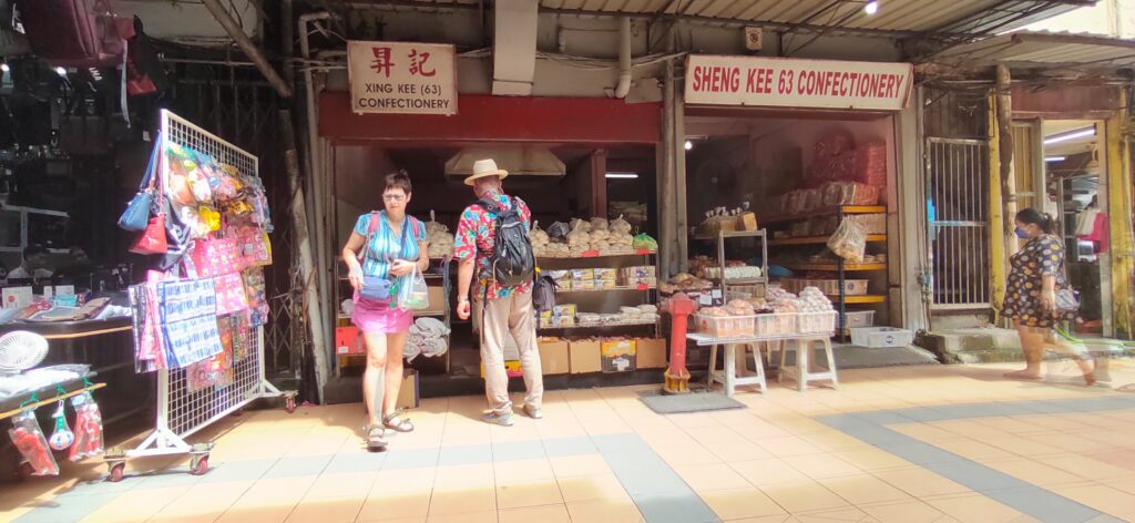 Visitors visiting alleyways of Chinese shops in Sibu Old town